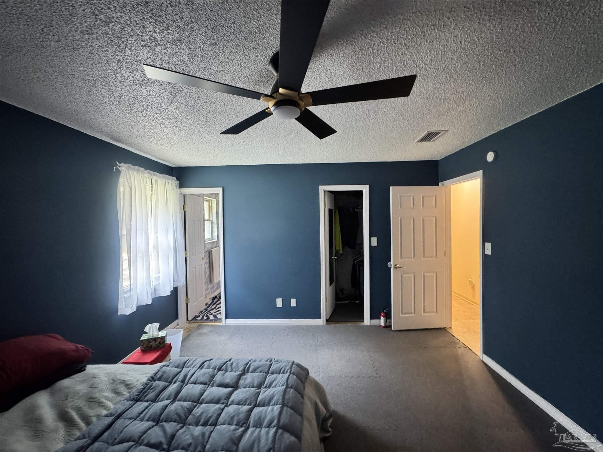 7210 Belgium Road Pensacola, FL 32526 - Photo 17 of 37 a bedroom with a bed and a window