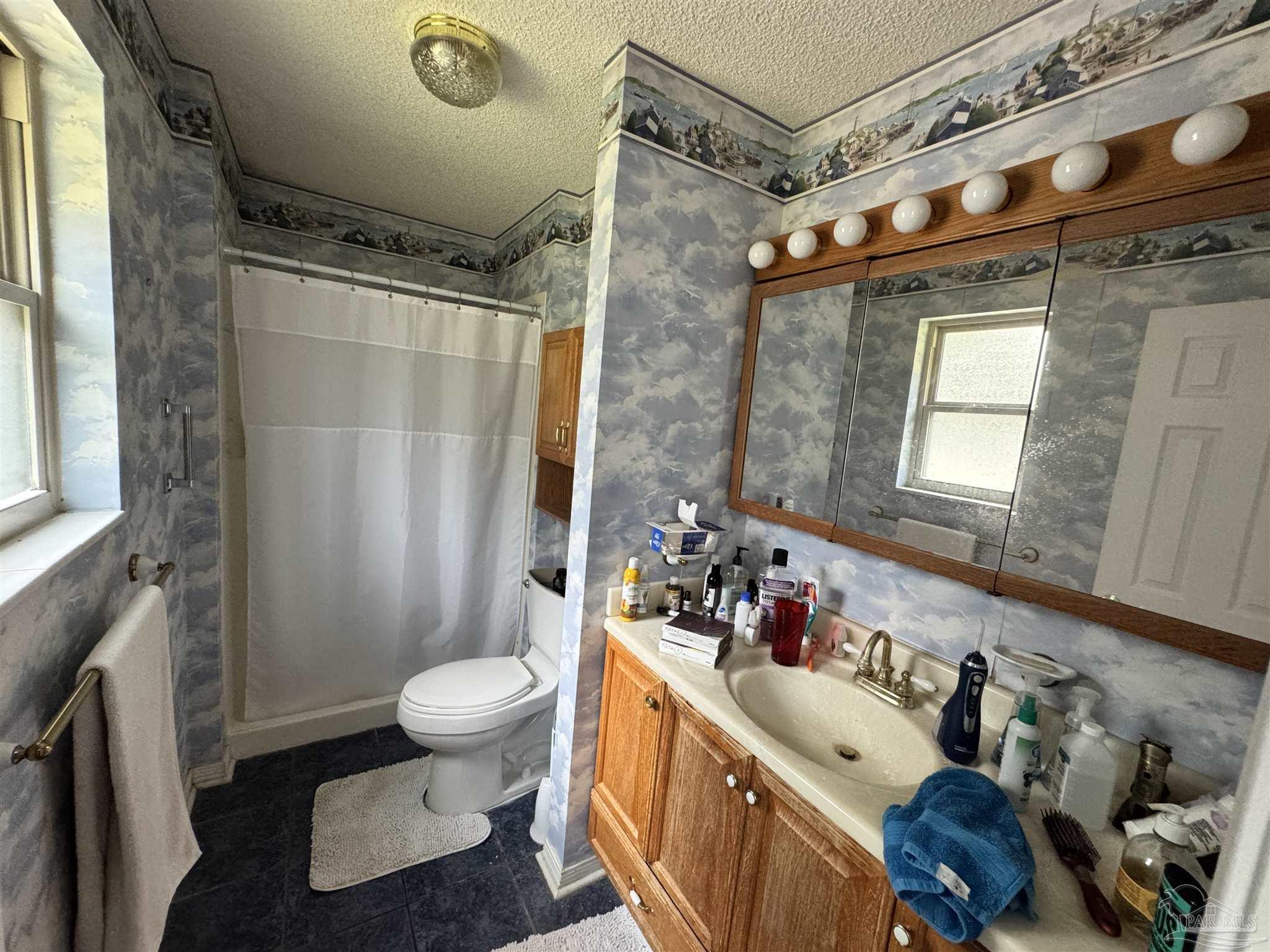 7210 Belgium Road Pensacola, FL 32526 - Photo 19 of 37 a bathroom with a sink toilet and shower