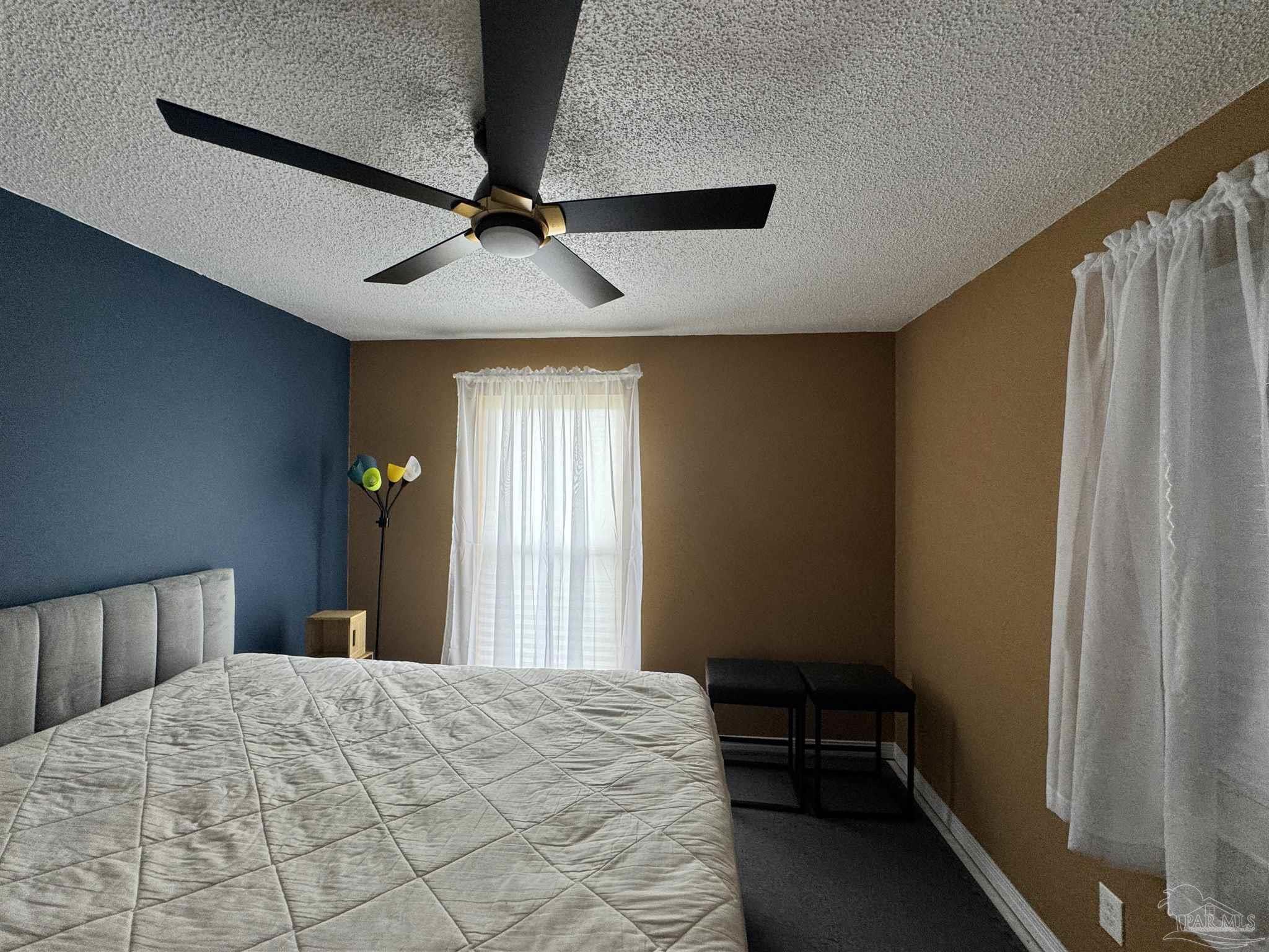 7210 Belgium Road Pensacola, FL 32526 - Photo 24 of 37 a bedroom with a bed and a window