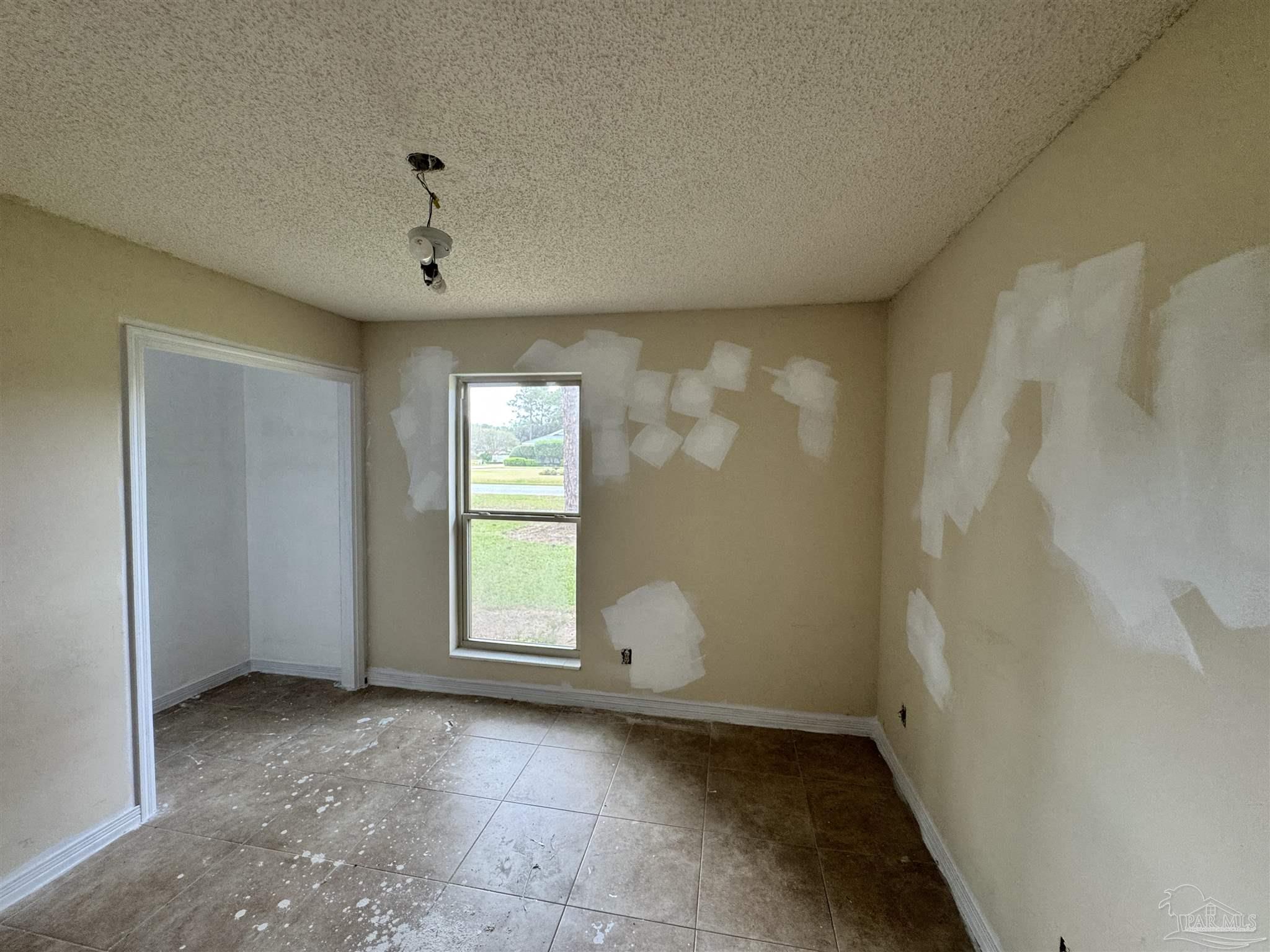 7210 Belgium Road Pensacola, FL 32526 - Photo 27 of 37 a view of an empty room with a window