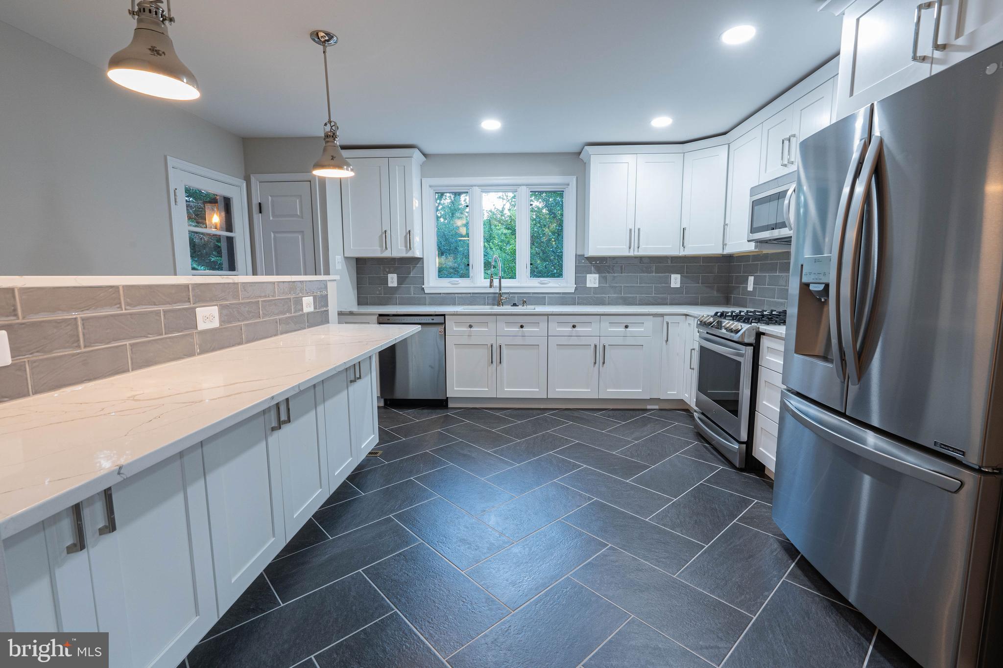 5103 Falls Rd Terrace Baltimore, MD 21210 - Photo 7 of 31 Fully renovated kitchen with large breakfast bar