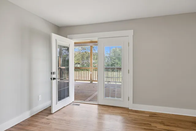 a view of a balcony with wooden floor