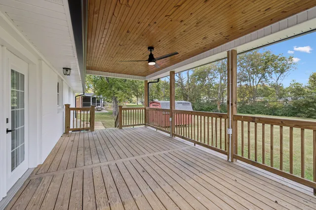 a view of porch with wooden floor