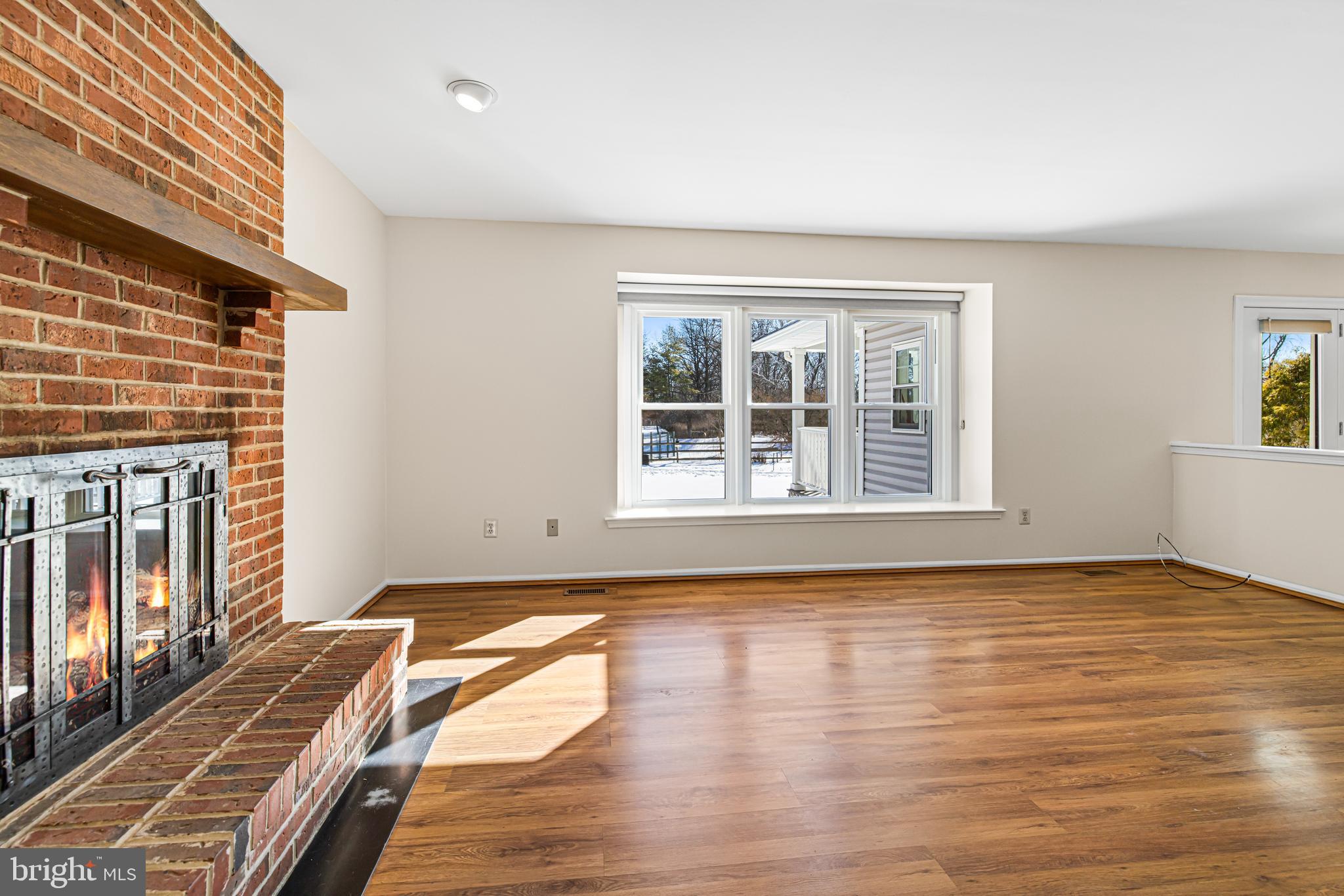2249 Lilac Lane Jamison, PA 18929 - Photo 18 of 61 a view of an empty room with wooden floor and a window