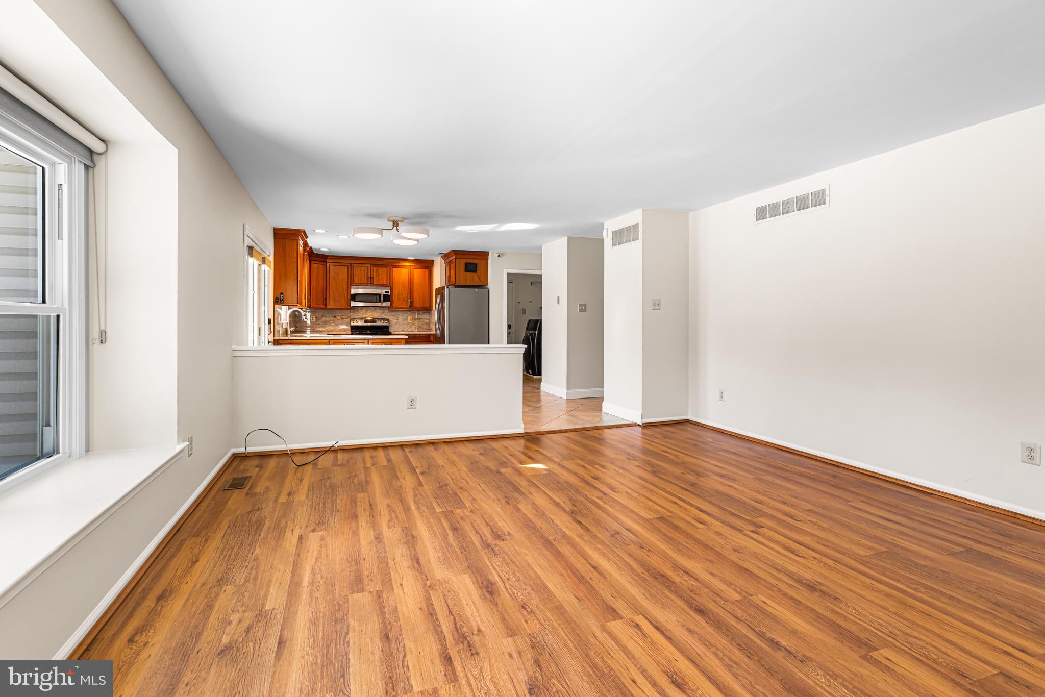2249 Lilac Lane Jamison, PA 18929 - Photo 19 of 61 a view of empty room with wooden floor and fan