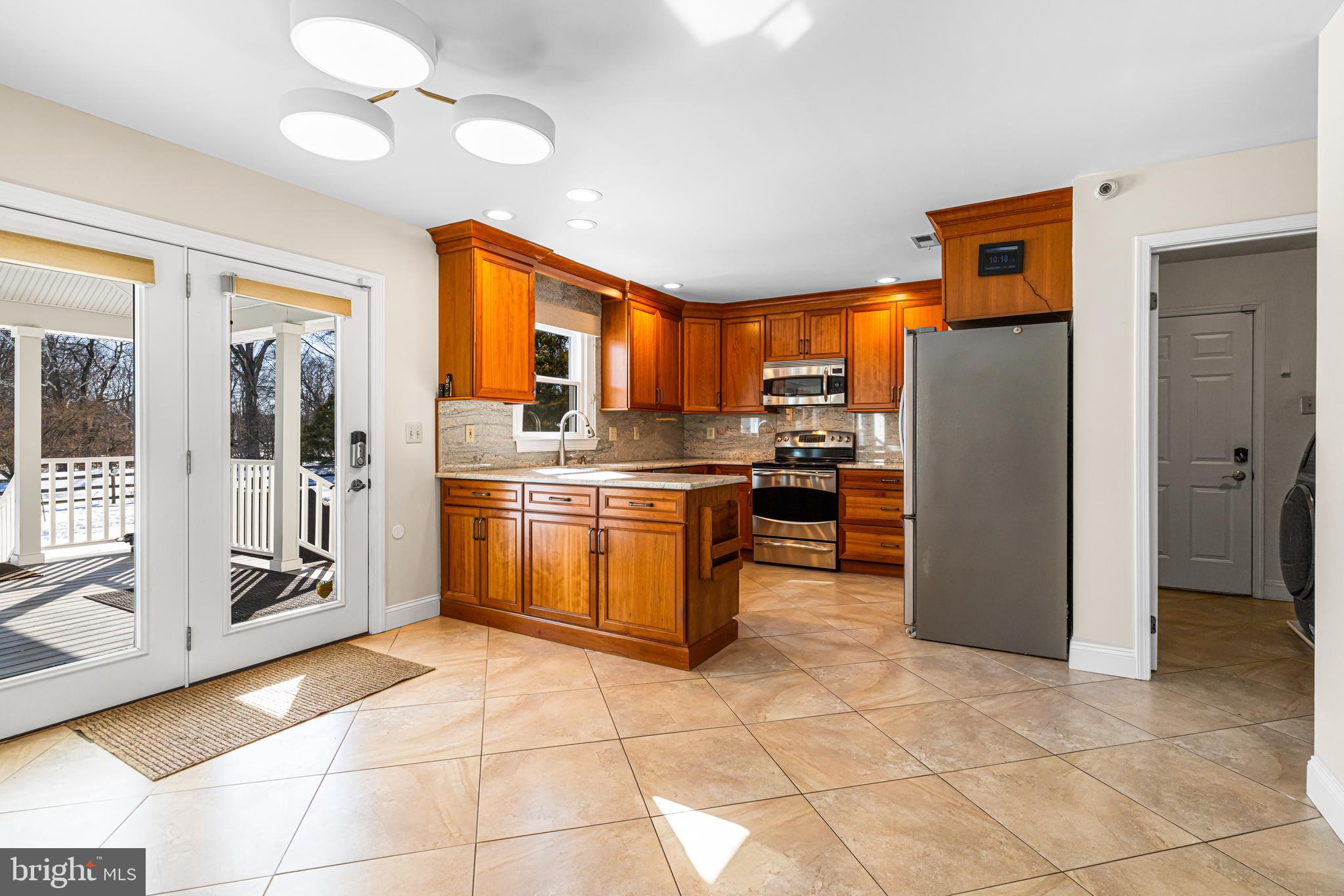 2249 Lilac Lane Jamison, PA 18929 - Photo 22 of 61 a kitchen with stainless steel appliances granite countertop a refrigerator and a sink