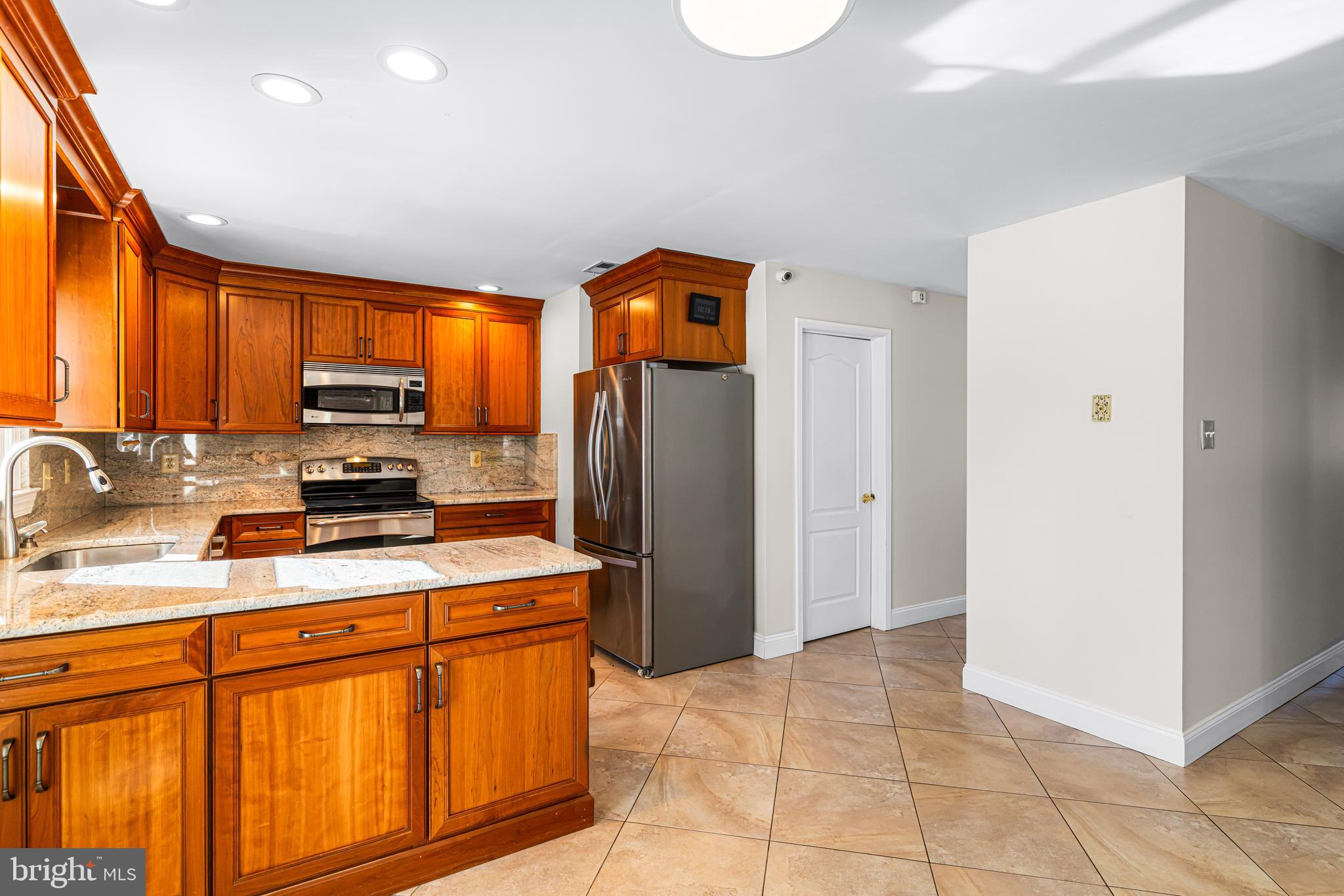 2249 Lilac Lane Jamison, PA 18929 - Photo 23 of 61 a kitchen with stainless steel appliances granite countertop a refrigerator stove and sink