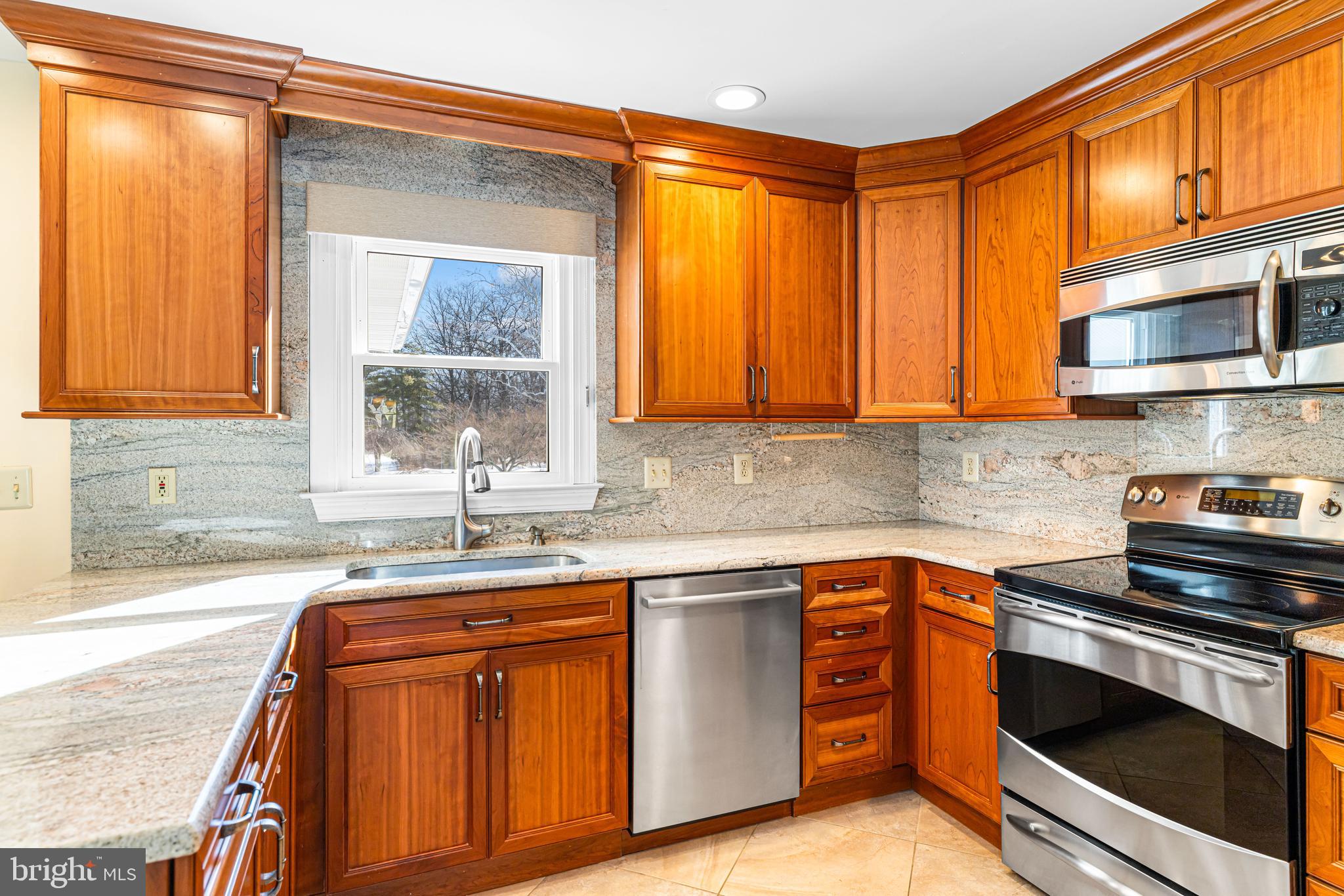 2249 Lilac Lane Jamison, PA 18929 - Photo 24 of 61 a kitchen with stainless steel appliances granite countertop a sink and cabinets