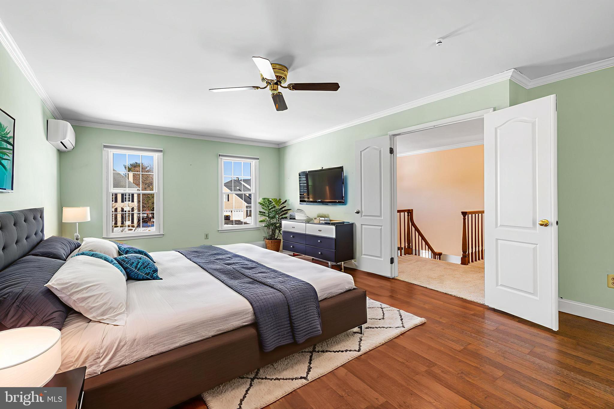 2249 Lilac Lane Jamison, PA 18929 - Photo 32 of 61 a bedroom with a bed wooden floor and large window