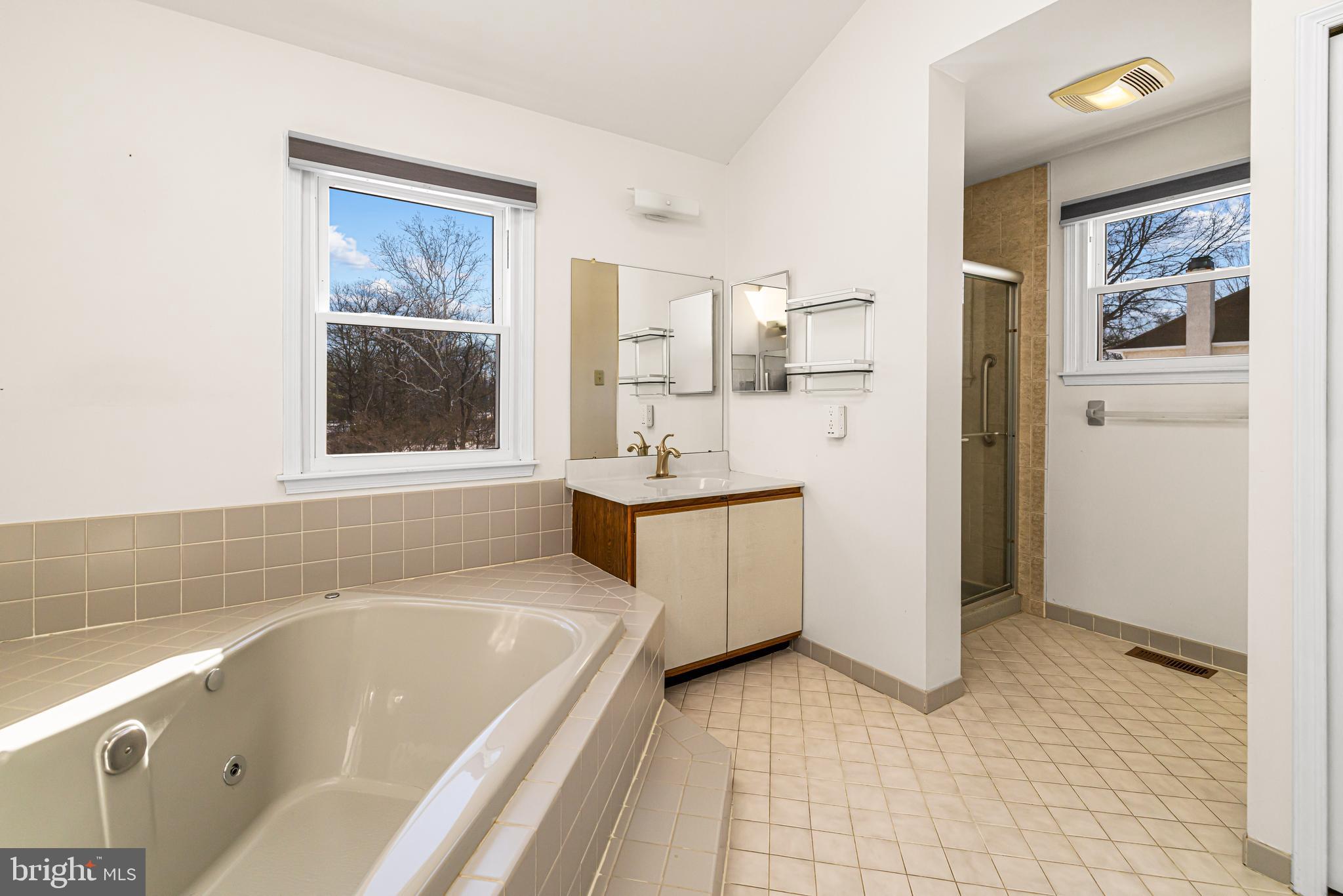 2249 Lilac Lane Jamison, PA 18929 - Photo 35 of 61 a bathroom with a tub sink and mirror