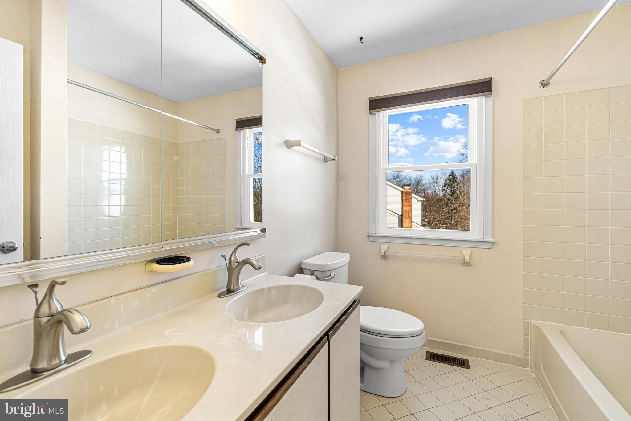 2249 Lilac Lane Jamison, PA 18929 - Photo 36 of 61 a bathroom with a toilet sink and mirror