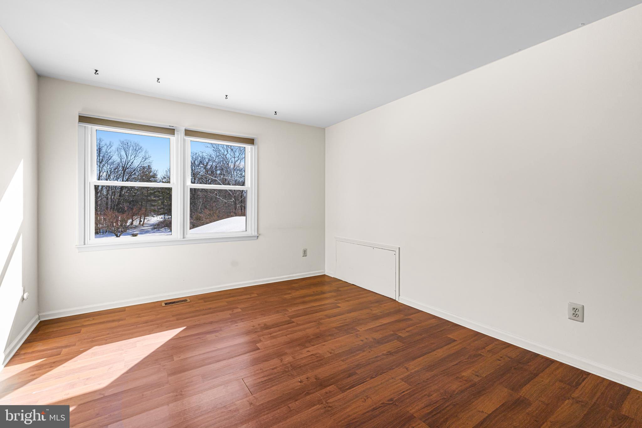 2249 Lilac Lane Jamison, PA 18929 - Photo 37 of 61 a view of empty room with wooden floor and fan