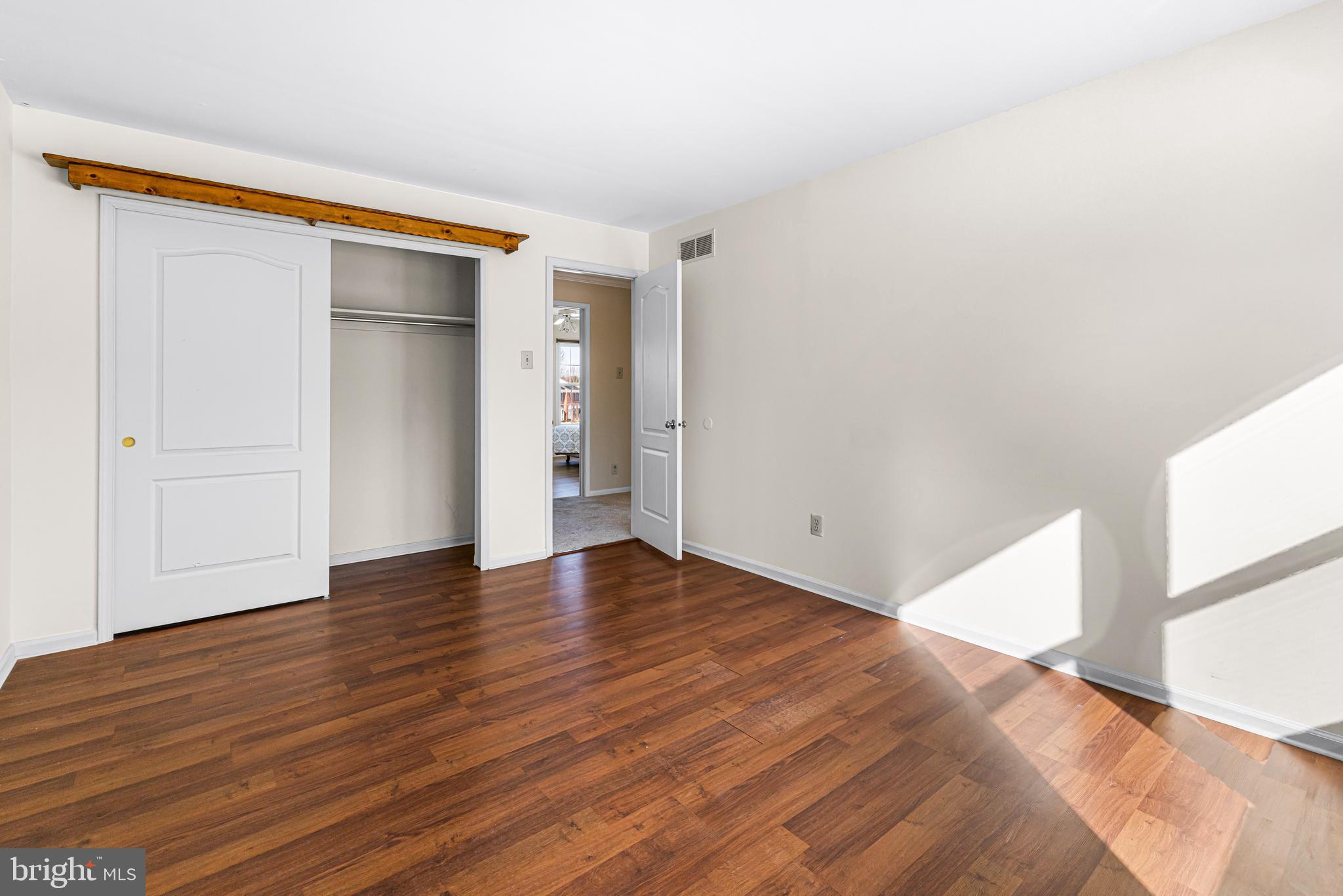 2249 Lilac Lane Jamison, PA 18929 - Photo 38 of 61 a view of an empty room with wooden floor and a window