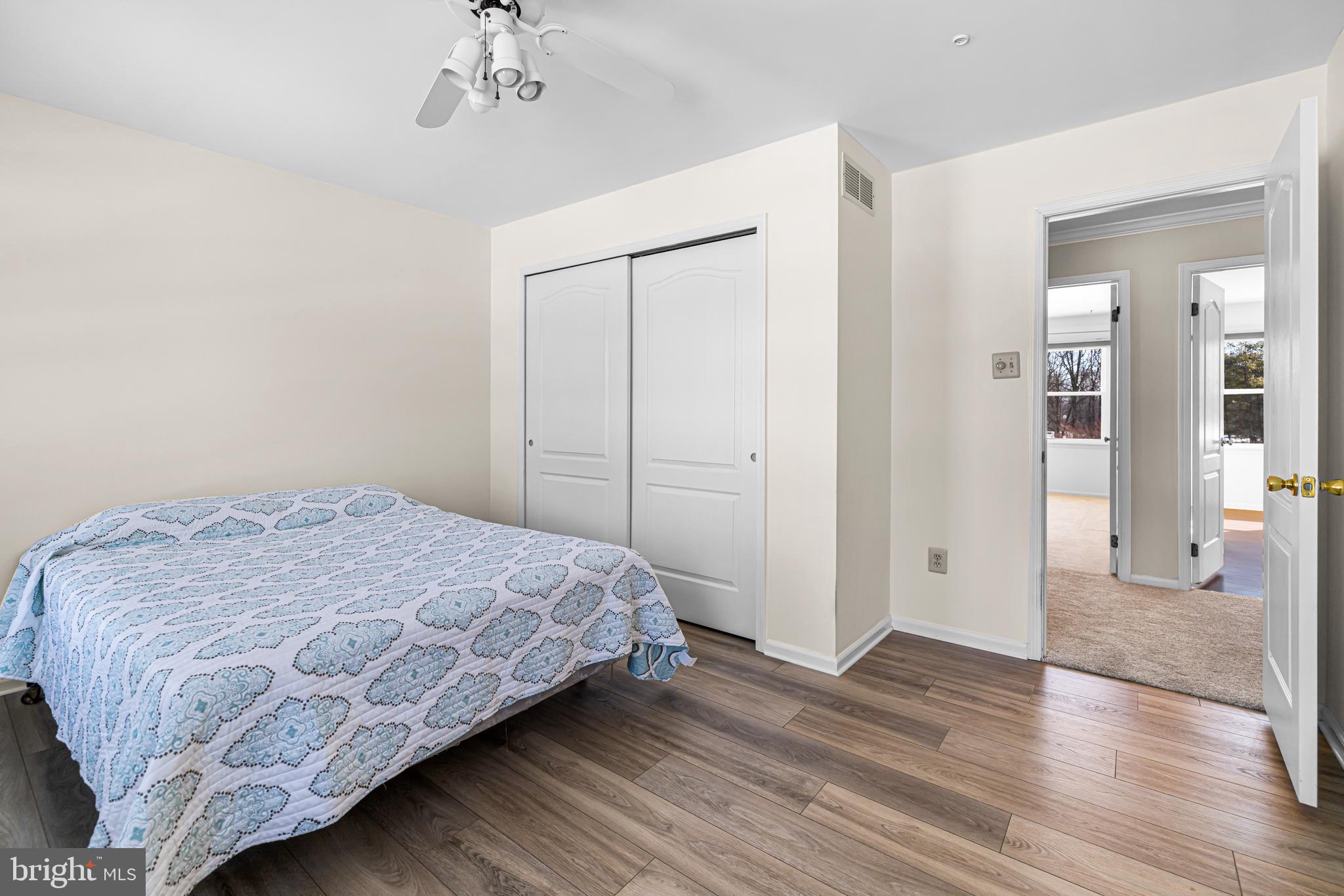 2249 Lilac Lane Jamison, PA 18929 - Photo 42 of 61 a bedroom with a bed and a chandelier