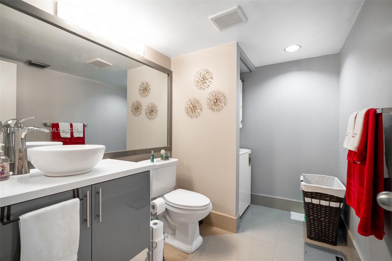 1201 Southwest 128th Terrace, Unit 407E Pembroke Pines, FL 33027 - Photo 15 of 26 a bathroom with a toilet sink and a shower