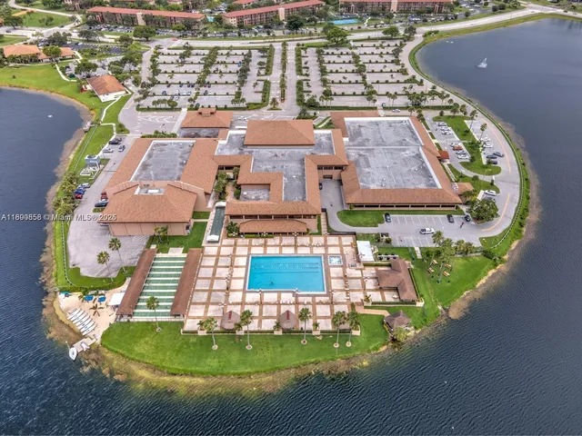 a front view of building with small garden