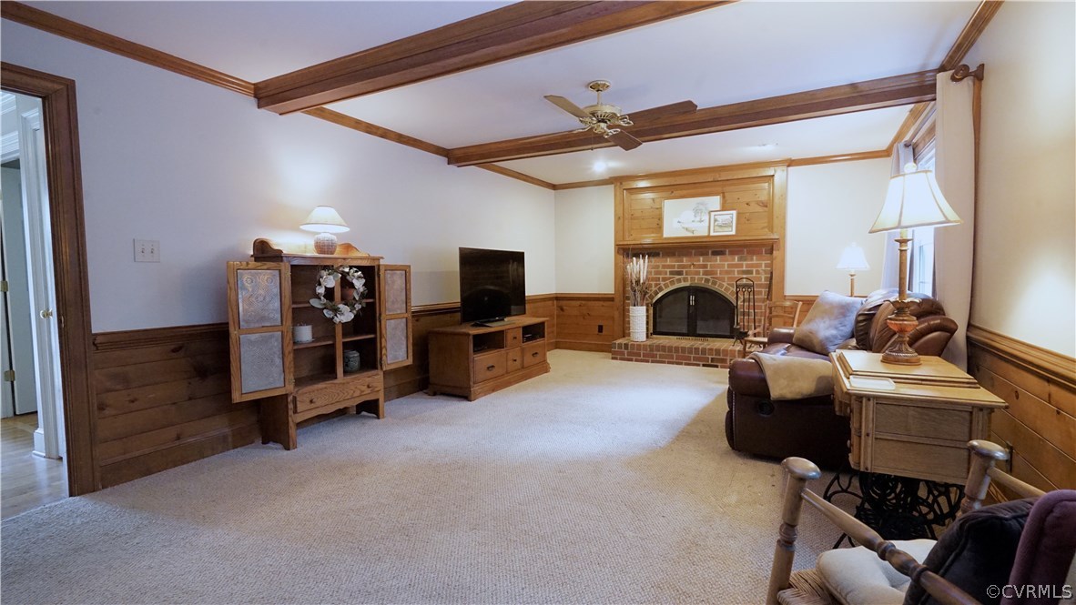 Family room features wood beams, horizontal "ship