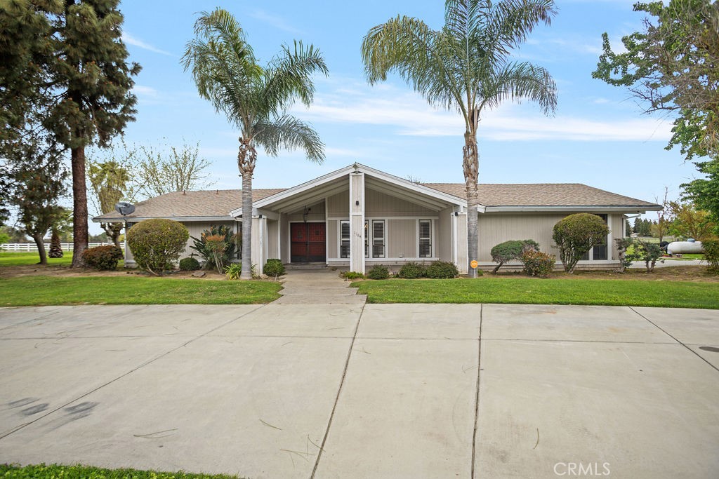 1184 Farmland Avenue Merced, CA 95340 - Photo 1 of 1 a front view of house with yard and green space