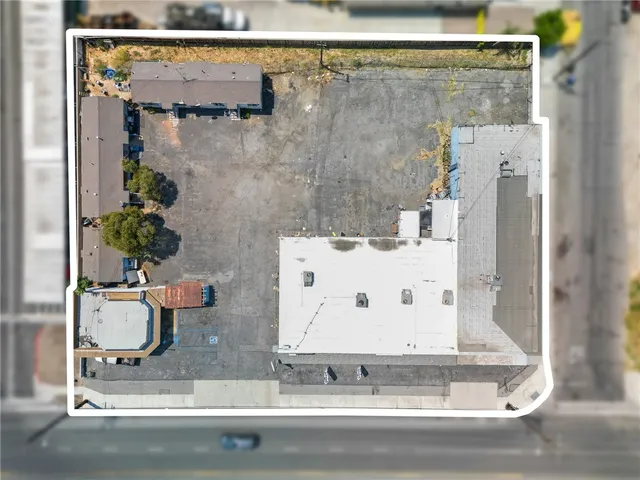 a bathroom with a granite countertop shower and a mirror