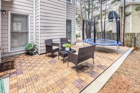 a view of a house with backyard and porch