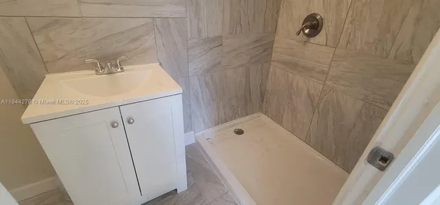 a bathroom with a sink and vanity