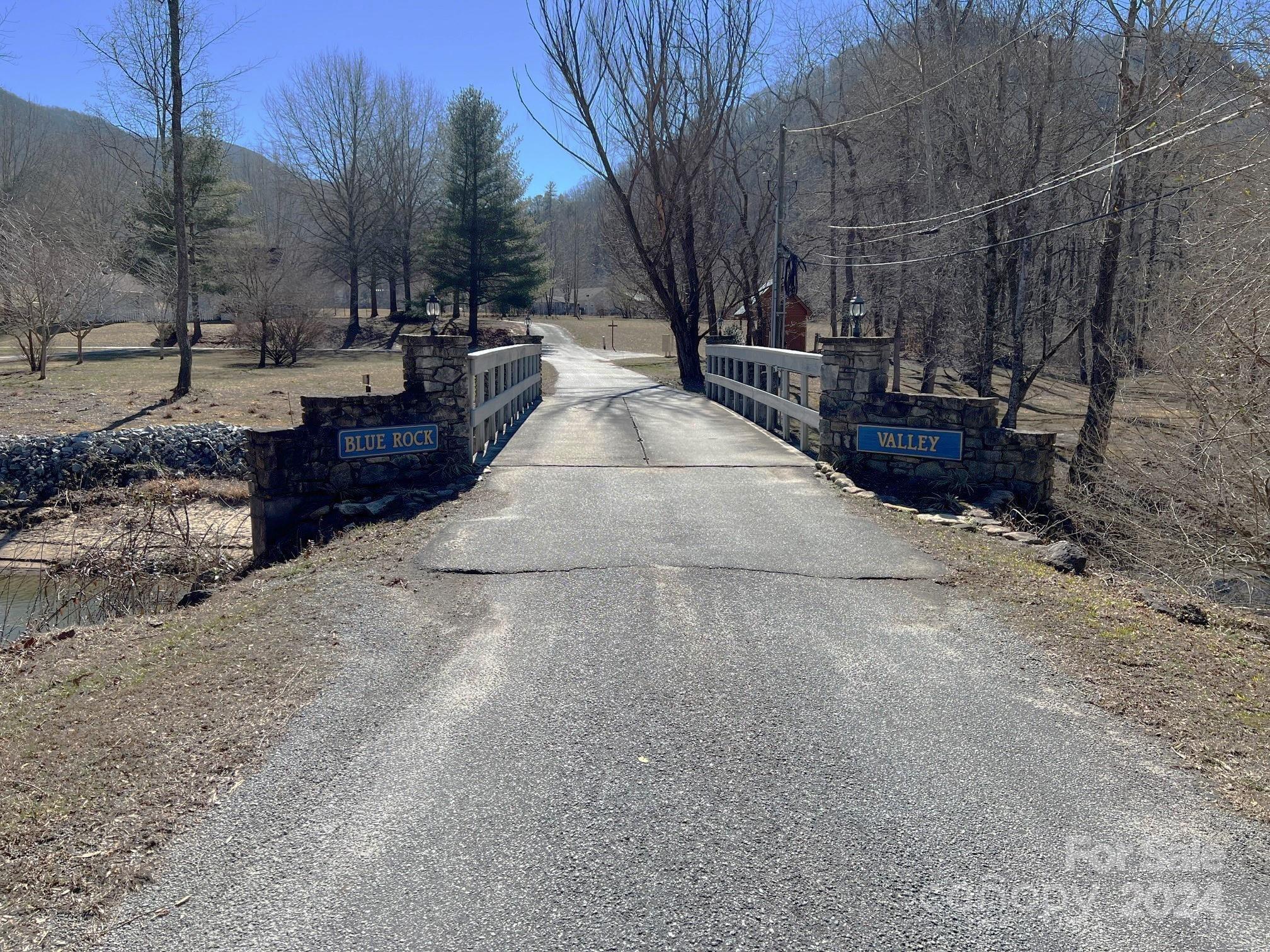 0 Blue Rock Road, Unit 18 Hendersonville, NC 28792 - Photo 2 of 15 a view of street with trees