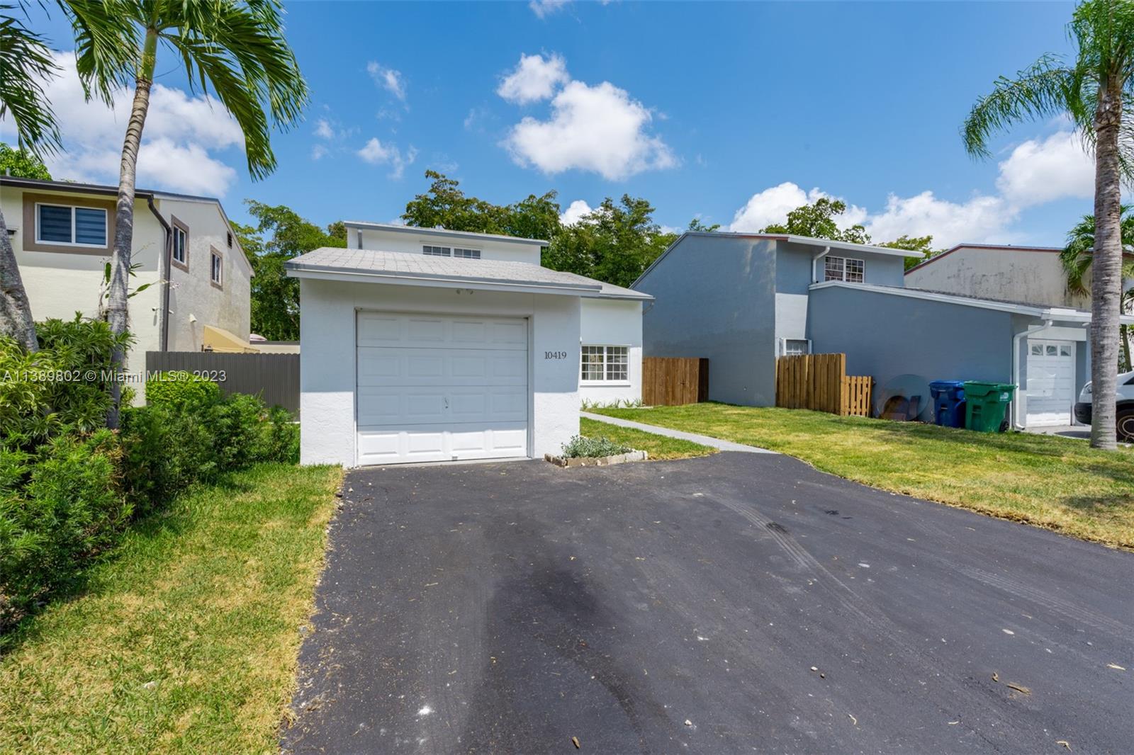 The Hammocks Miami, FL 33196 - Photo 3 of 38 a view of a house with a yard and garage