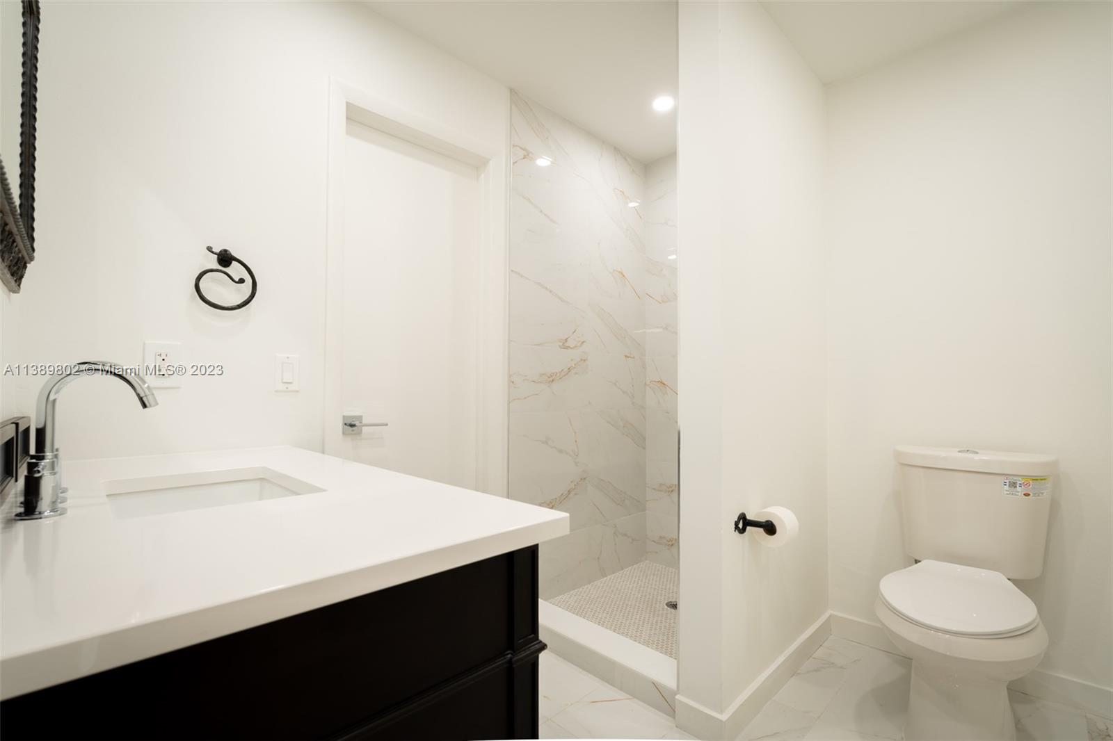 The Hammocks Miami, FL 33196 - Photo 33 of 38 a bathroom with a sink toilet and shower