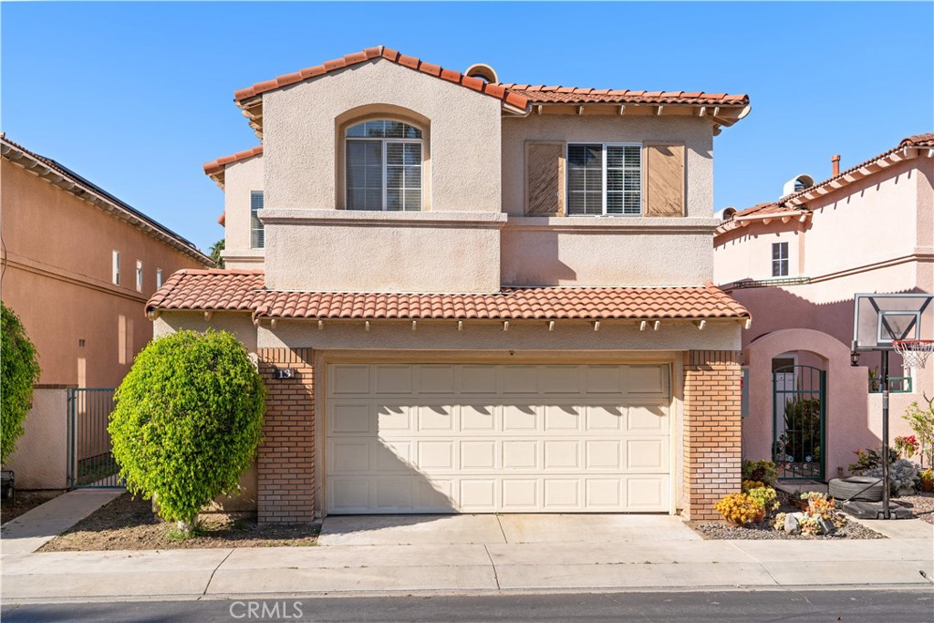 a front view of a house with a garage