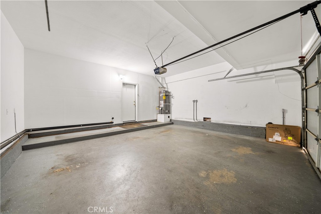 688 North Rimsdale Avenue, Unit 13 Covina, CA 91722 - Photo 14 of 52 a view of a room with racks on the wall