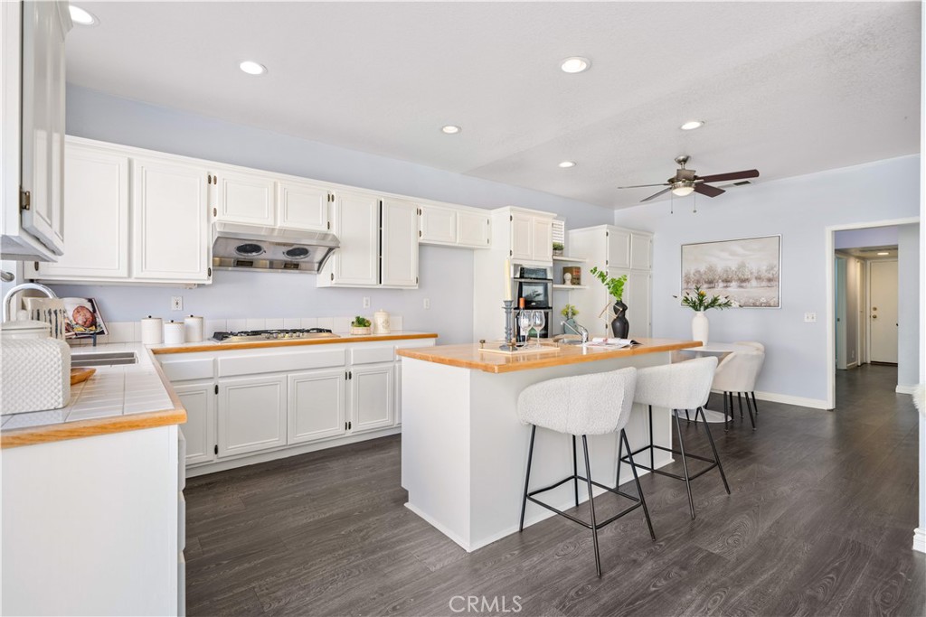 688 North Rimsdale Avenue, Unit 13 Covina, CA 91722 - Photo 19 of 52 a kitchen with a sink cabinets and wooden floor