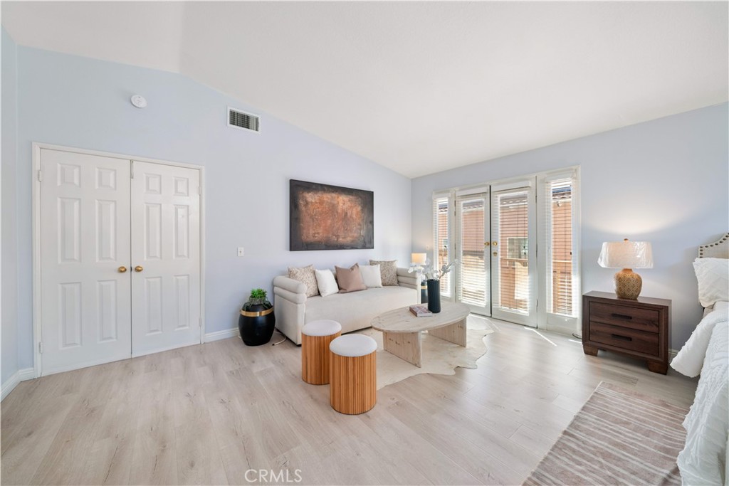 688 North Rimsdale Avenue, Unit 13 Covina, CA 91722 - Photo 24 of 52 a living room with furniture and a wooden floor