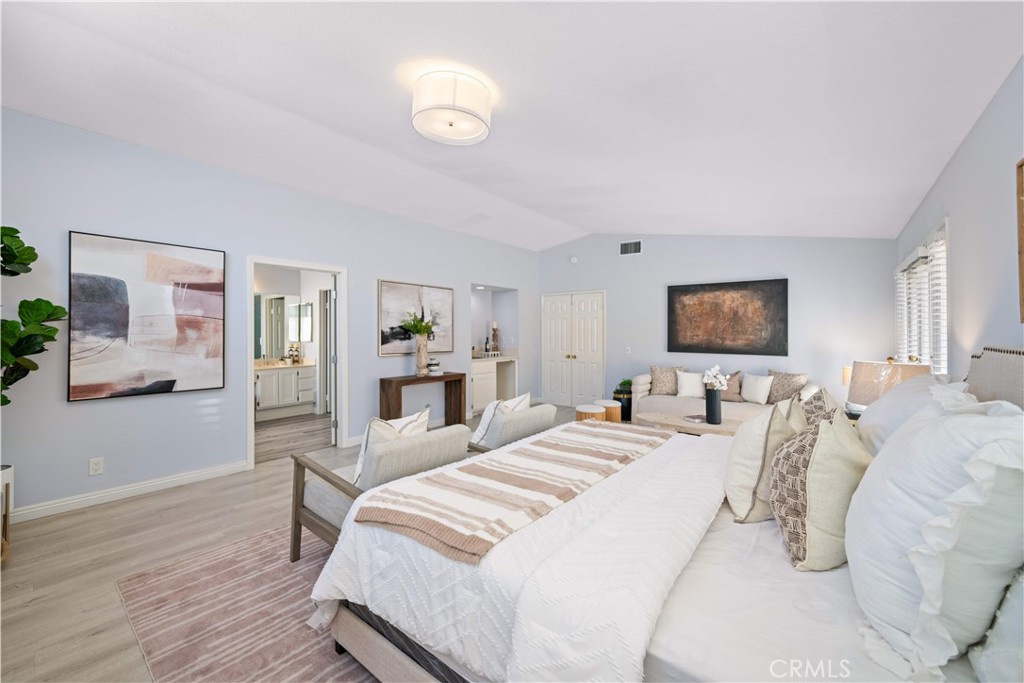 688 North Rimsdale Avenue, Unit 13 Covina, CA 91722 - Photo 27 of 52 a bedroom with a bed and a flat screen tv