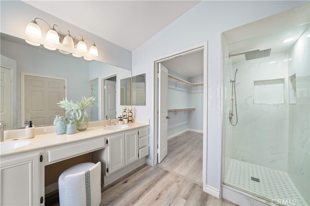 688 North Rimsdale Avenue, Unit 13 Covina, CA 91722 - Photo 29 of 52 a bathroom with a double vanity sink mirror and shower