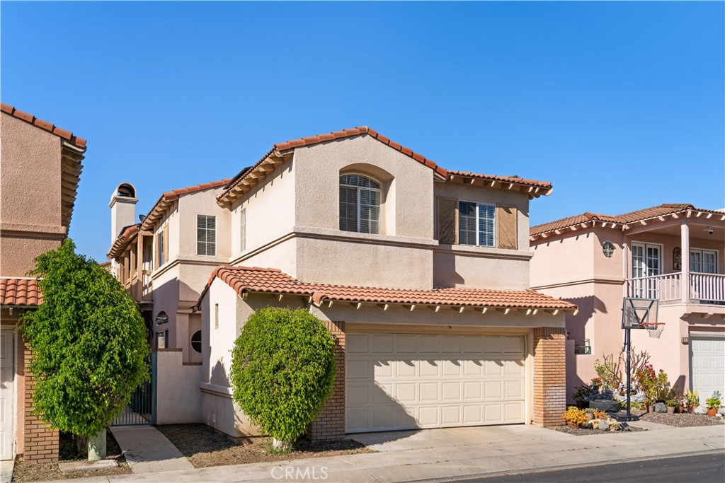 688 North Rimsdale Avenue, Unit 13 Covina, CA 91722 - Photo 3 of 52 a front view of a house with garden