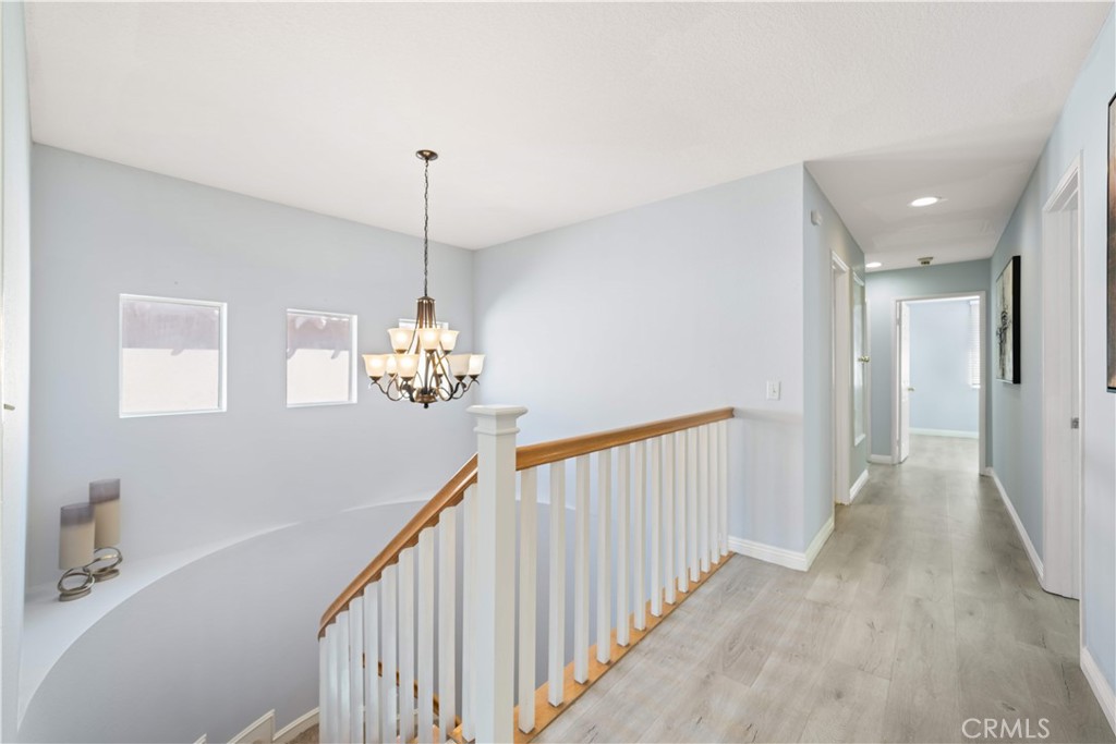 688 North Rimsdale Avenue, Unit 13 Covina, CA 91722 - Photo 35 of 52 a view of a hallway with windows
