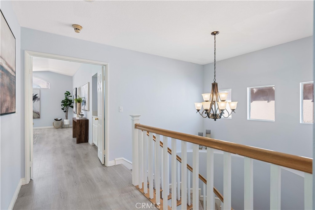 688 North Rimsdale Avenue, Unit 13 Covina, CA 91722 - Photo 36 of 52 a view of a room with wooden floor and stairs