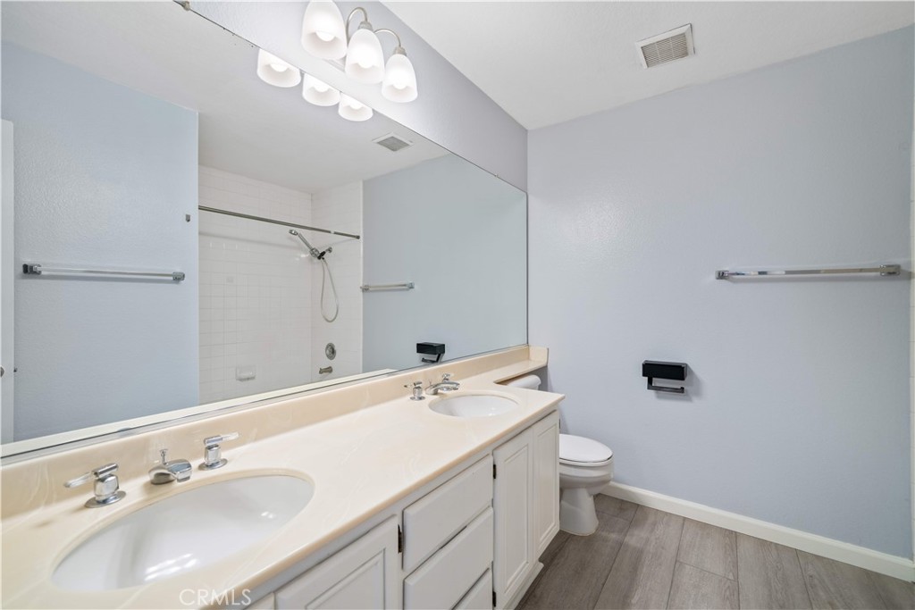 688 North Rimsdale Avenue, Unit 13 Covina, CA 91722 - Photo 42 of 52 a bathroom with a sink a toilet and shower
