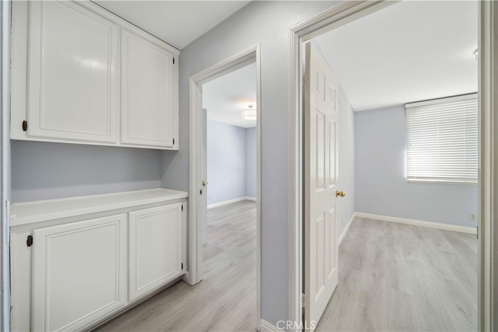 688 North Rimsdale Avenue, Unit 13 Covina, CA 91722 - Photo 43 of 52 a view of cabinets and wooden floor