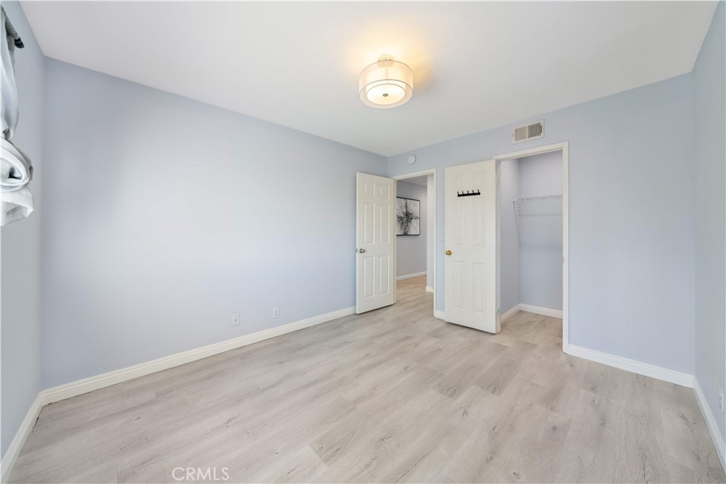 688 North Rimsdale Avenue, Unit 13 Covina, CA 91722 - Photo 46 of 52 a view of an empty room with a window