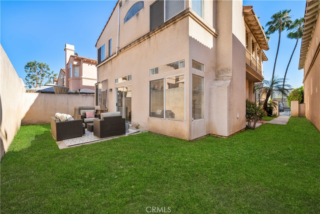 688 North Rimsdale Avenue, Unit 13 Covina, CA 91722 - Photo 49 of 52 a view of a house with backyard sitting area and garden