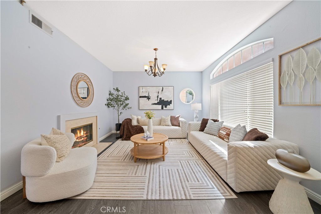 688 North Rimsdale Avenue, Unit 13 Covina, CA 91722 - Photo 7 of 52 a living room with furniture a rug and a window