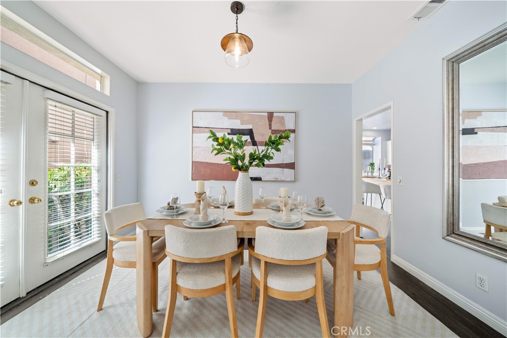 688 North Rimsdale Avenue, Unit 13 Covina, CA 91722 - Photo 9 of 52 a dining room with furniture a rug and a large window