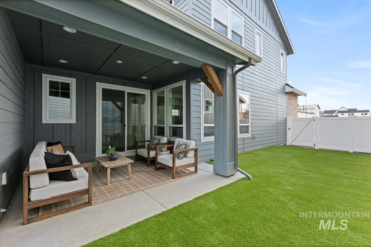 13338 North Spring Creek Way Boise, ID 83714 - Photo 34 of 46 Covered patio with recessed lighting, concrete flooring, and an adjacent artificial turf yard