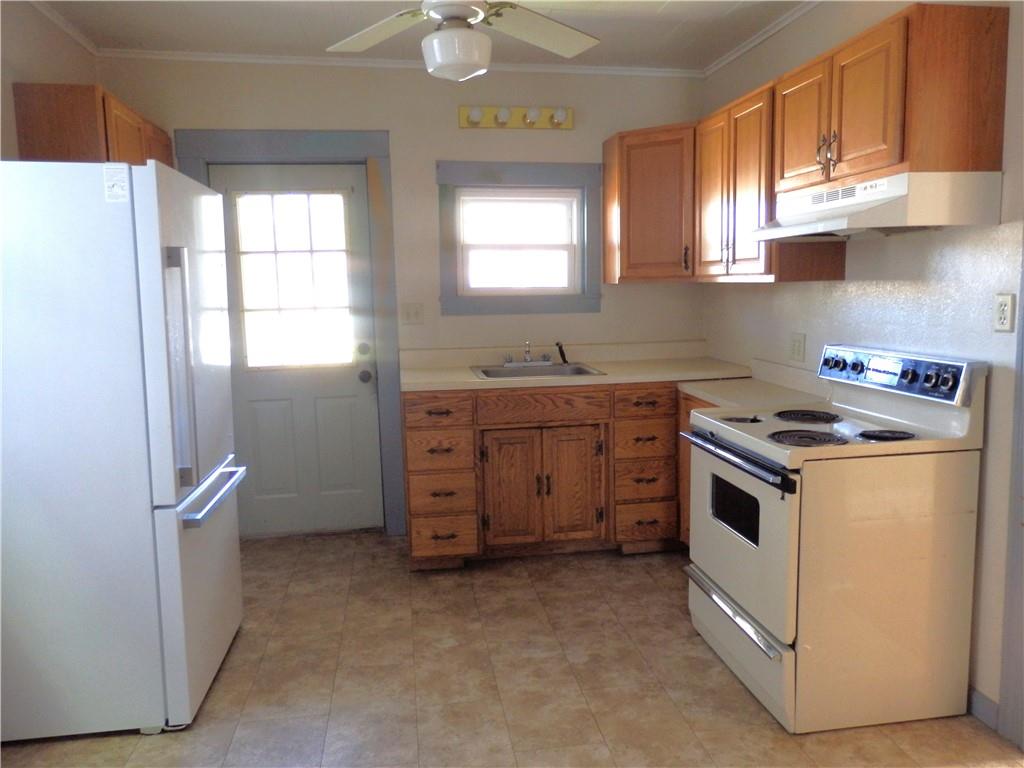 621 Williams Street Confluence, PA 15424 - Photo 13 of 21 a kitchen with a stove and a sink