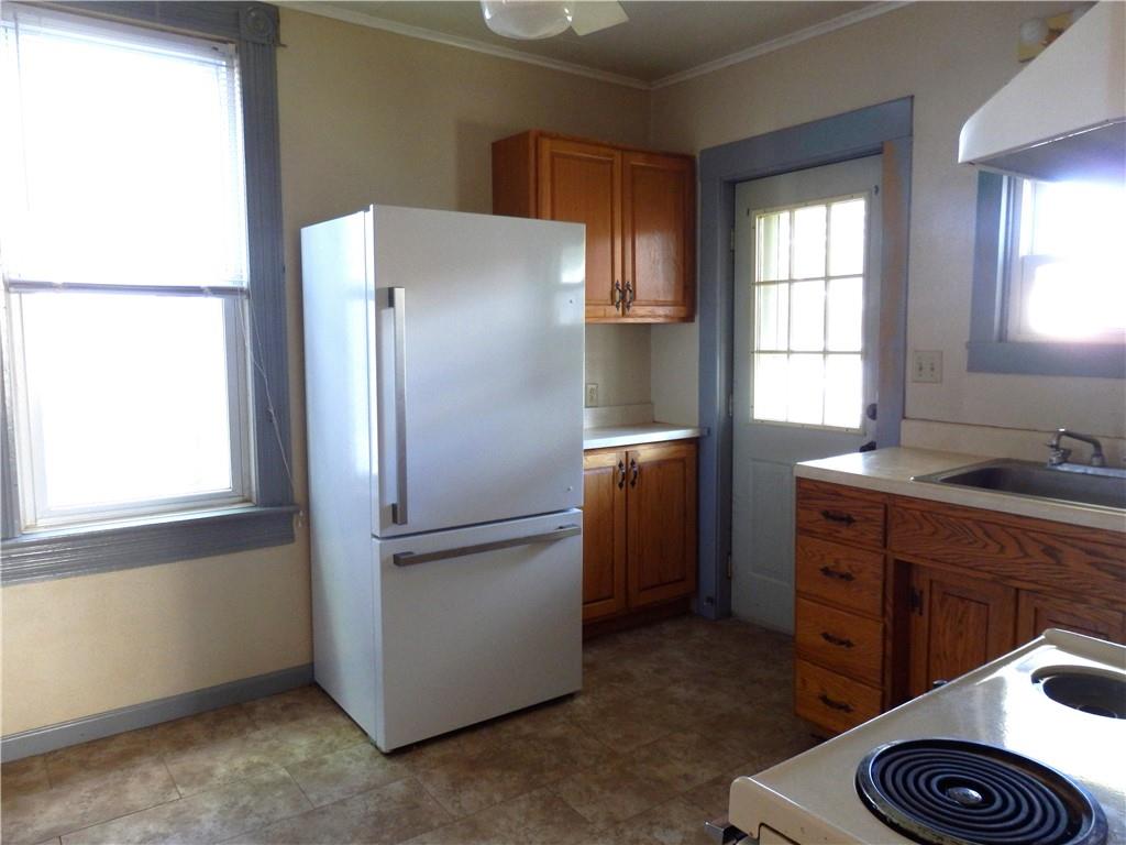 621 Williams Street Confluence, PA 15424 - Photo 14 of 21 a kitchen with stainless steel appliances granite countertop a refrigerator and a sink