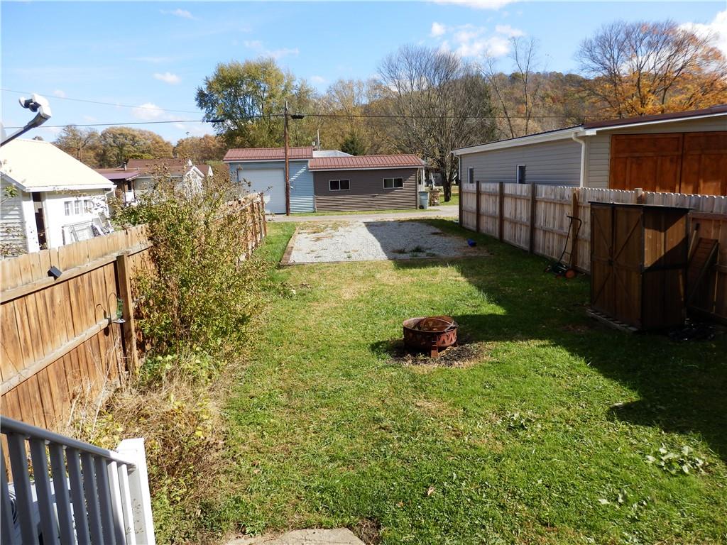 621 Williams Street Confluence, PA 15424 - Photo 7 of 21 a view of a backyard with wooden fence
