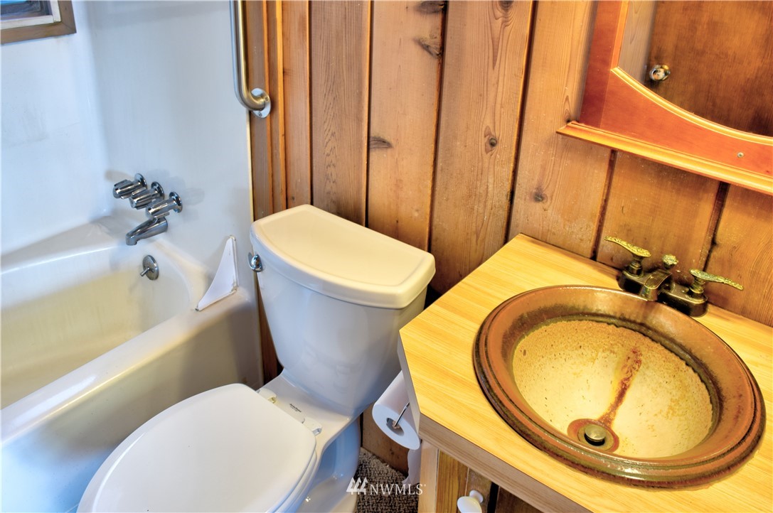 7130 Sandy Point Road Northeast Olympia, WA 98516 - Photo 12 of 32 a bathroom with a toilet and a sink
