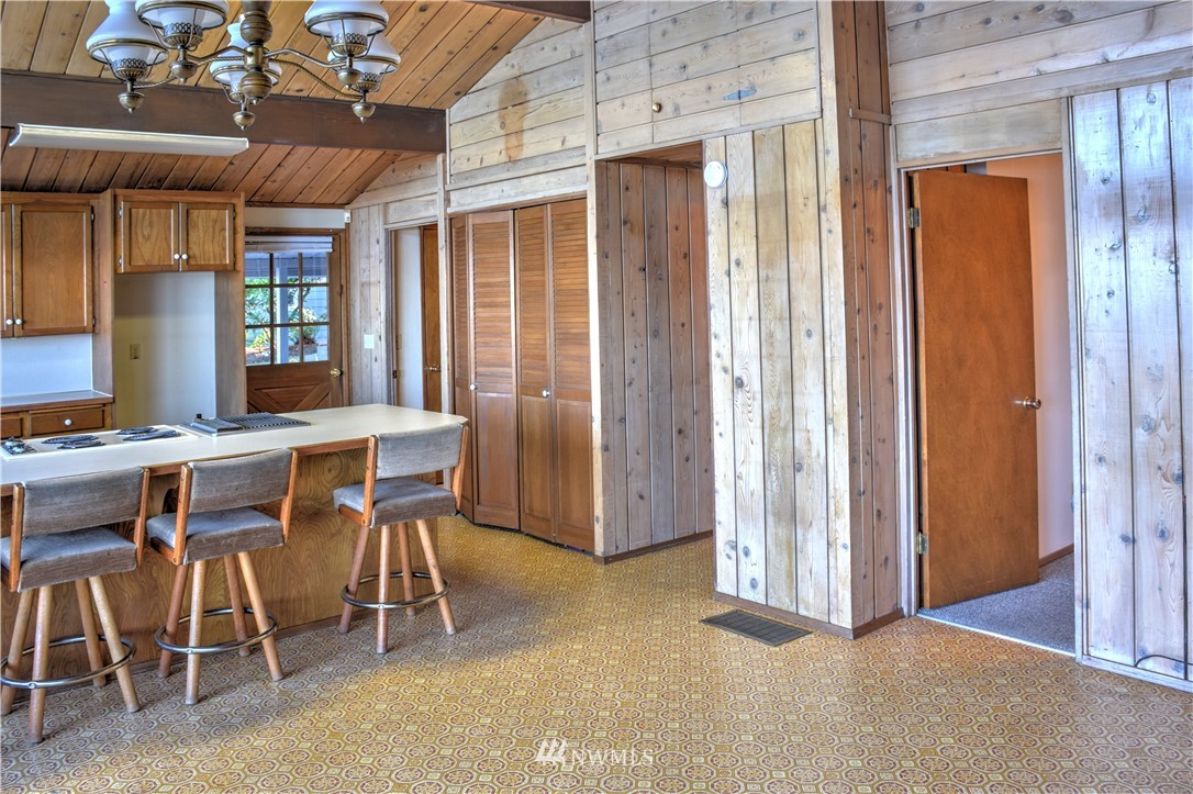 7130 Sandy Point Road Northeast Olympia, WA 98516 - Photo 13 of 32 a view of a dining room with furniture