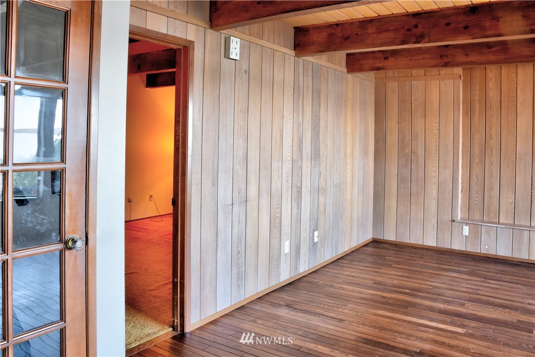 7130 Sandy Point Road Northeast Olympia, WA 98516 - Photo 16 of 32 a view of wooden floor and brick walls